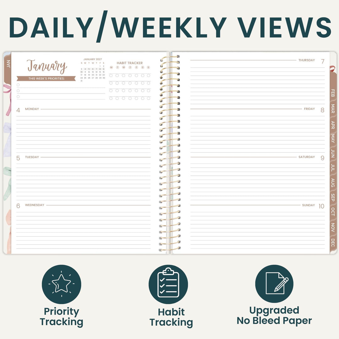 An open spiral-bound planner shown on a light beige background with the heading 'DAILY/WEEKLY VIEWS' at the top. The planner pages display a January weekly layout with columns for Monday through Sunday, habit tracker stars, and lined writing areas.