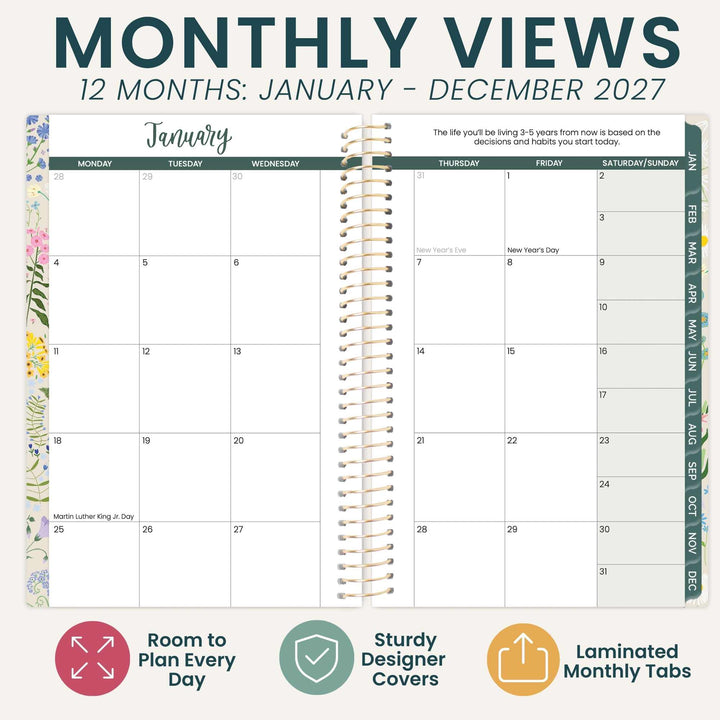 A monthly planner spread showing January 2026 with a spiral binder in the center and columns for weekdays and a date page. The top reads 'MONTHLY VIEWS 12 MONTHS: JANUARY - DECEMBER 2027' and the bottom includes feature callouts: 'Room to Plan Every Day,' 'Sturdy Designer Covers,' and 'Laminated Monthly Tabs.