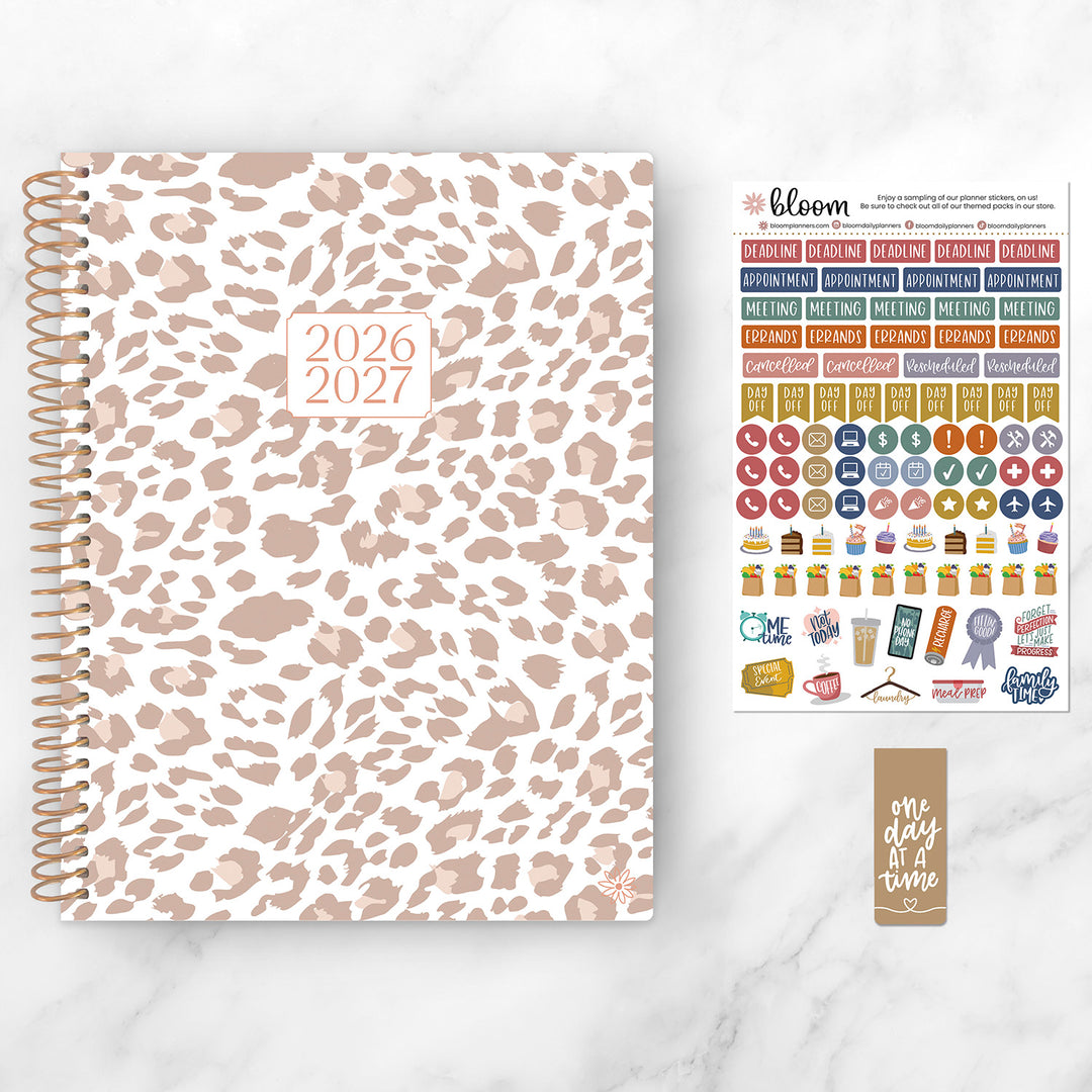 Leopard print planner with stickers on a white background