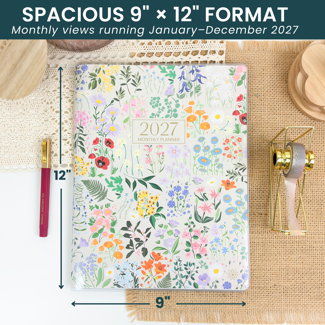 Floral planner with dimensions and 2027 branding on a textured surface.