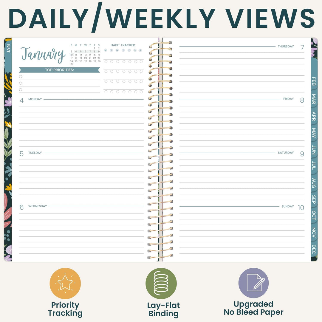An open spiral-bound planner showing a daily and weekly view layout with lined pages, calendar trackers, and decorative floral page edges. The top reads 'DAILY/WEEKLY VIEWS' and the bottom includes three feature icons and labels: Priority Tracking, Lay-Flat Binding, and Updated Bleed Paper.