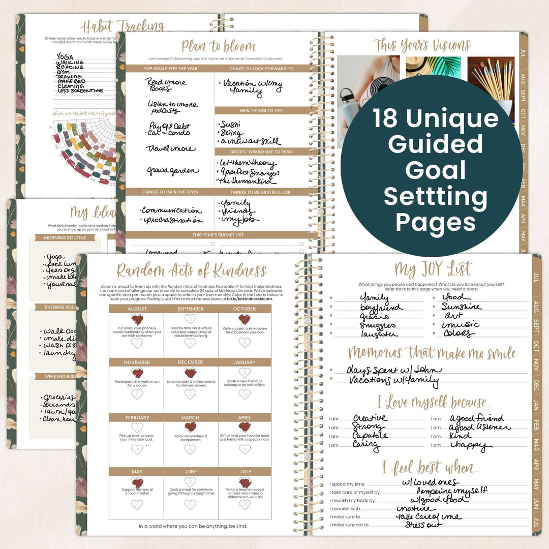 Open spiral-bound planner with various goal setting pages on a light background