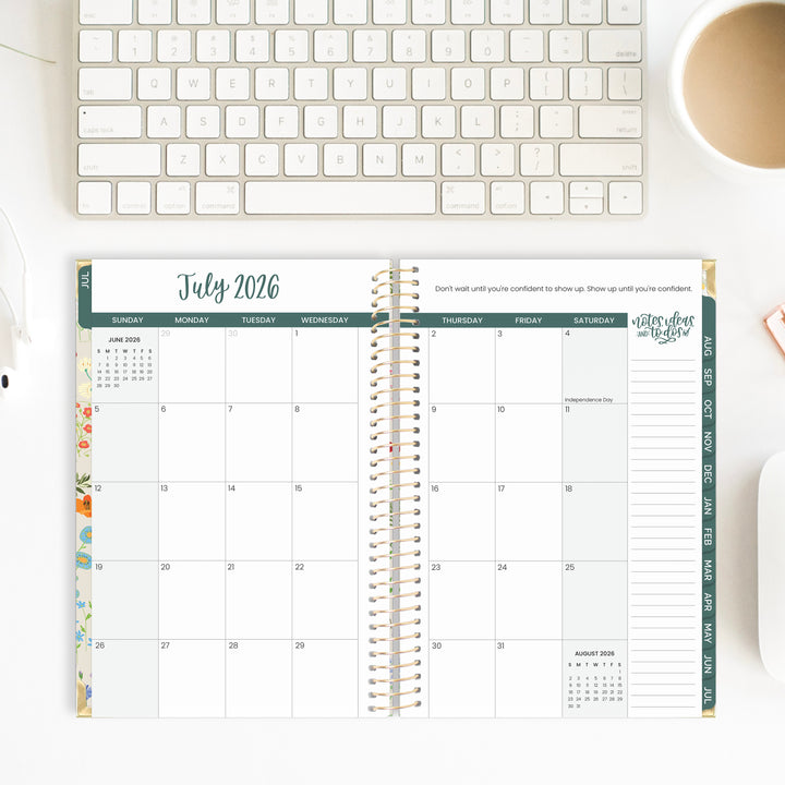 Calendar for July 2026 on a desk with a keyboard and mug in the background
