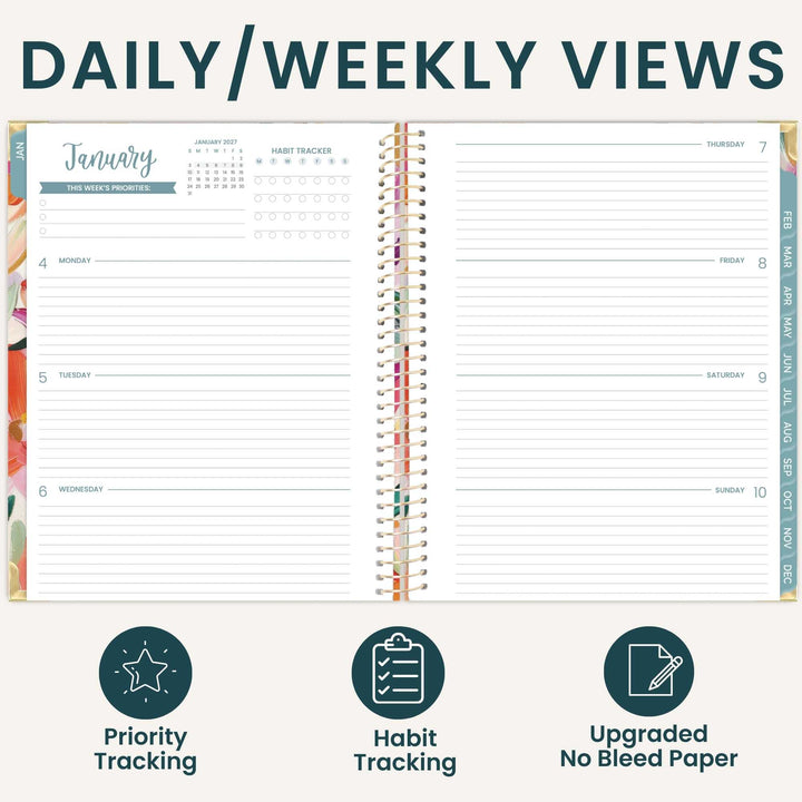 An open planner shown from above with the heading 'DAILY/WEEKLY VIEWS' at the top and three feature icons below: priority tracking, habit tracking, and upgraded no bleed paper. The planner pages are mostly white with teal and multicolor printed sections and a spiral binding.