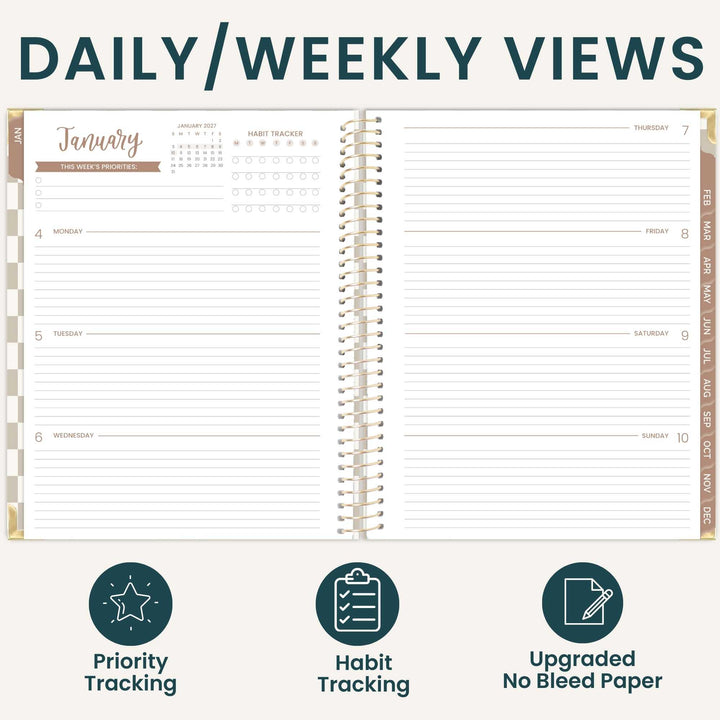 An open spiral-bound planner shown from the front with a daily and weekly view layout, titled 'DAILY/WEEKLY VIEWS.' The planner has lined pages, date columns, weekday sections, and tracking areas for priorities and habits.