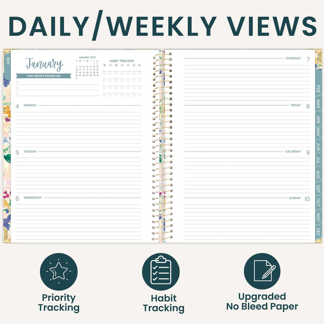 An open spiral-bound planner shown on a light beige background with the heading 'DAILY/WEEKLY VIEWS' at the top. The planner pages display a weekly layout with columns for Monday through Sunday, lined writing areas, and decorative teal accents.