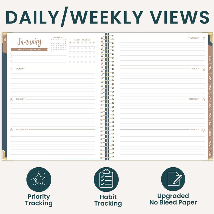 An open spiral-bound planner shown on a light beige background with the heading 'DAILY/WEEKLY VIEWS' at the top. The planner pages display a January weekly layout with columns for Monday through Sunday, habit tracking stars, and a calendar for January 1st.