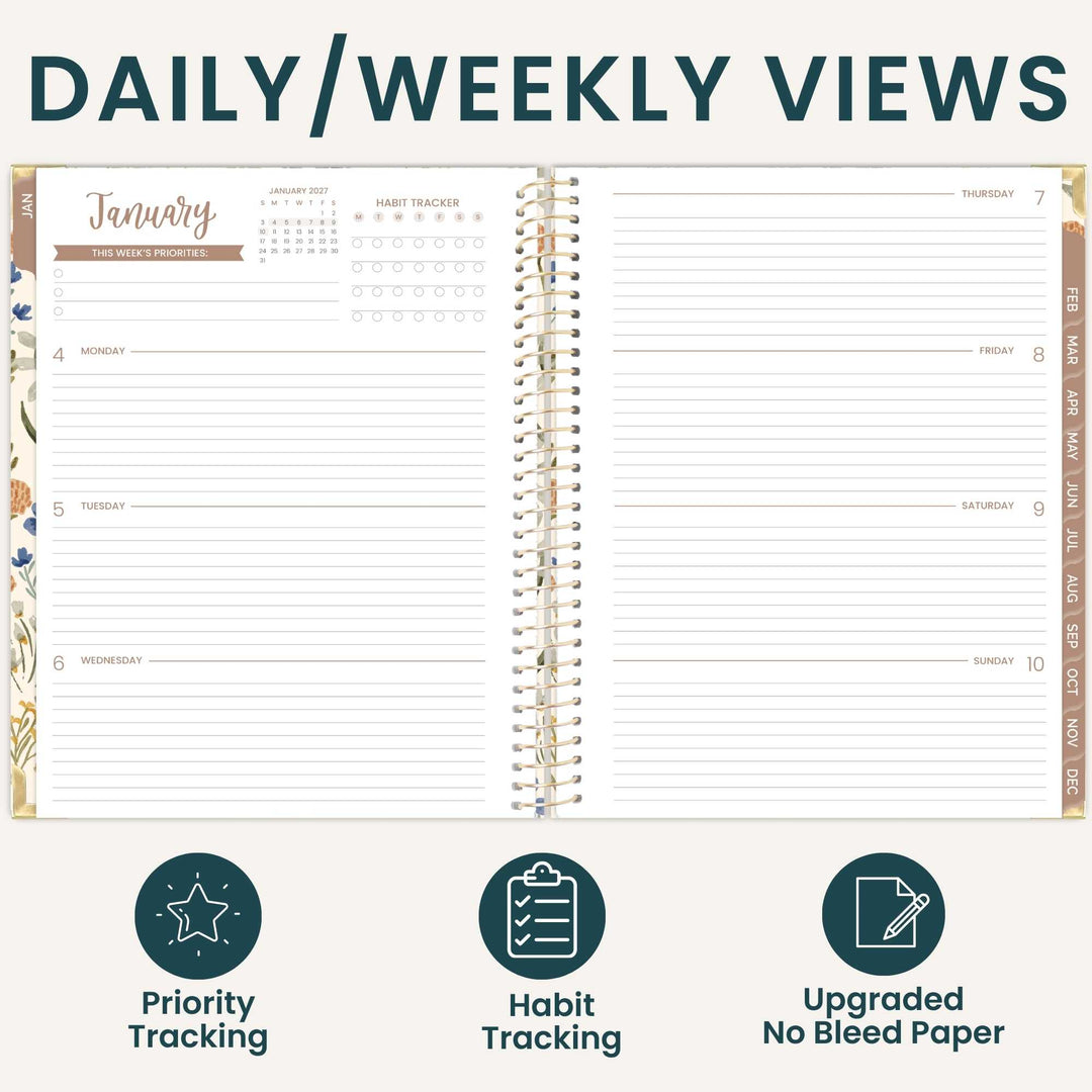 An open spiral-bound planner shown on a light beige background with the heading 'DAILY/WEEKLY VIEWS' at the top. The planner pages display a January weekly view with lined daily sections, a habit tracker, and decorative floral border details.