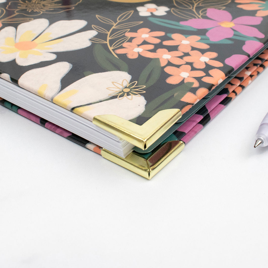 Floral planner with gold corner on a white background
