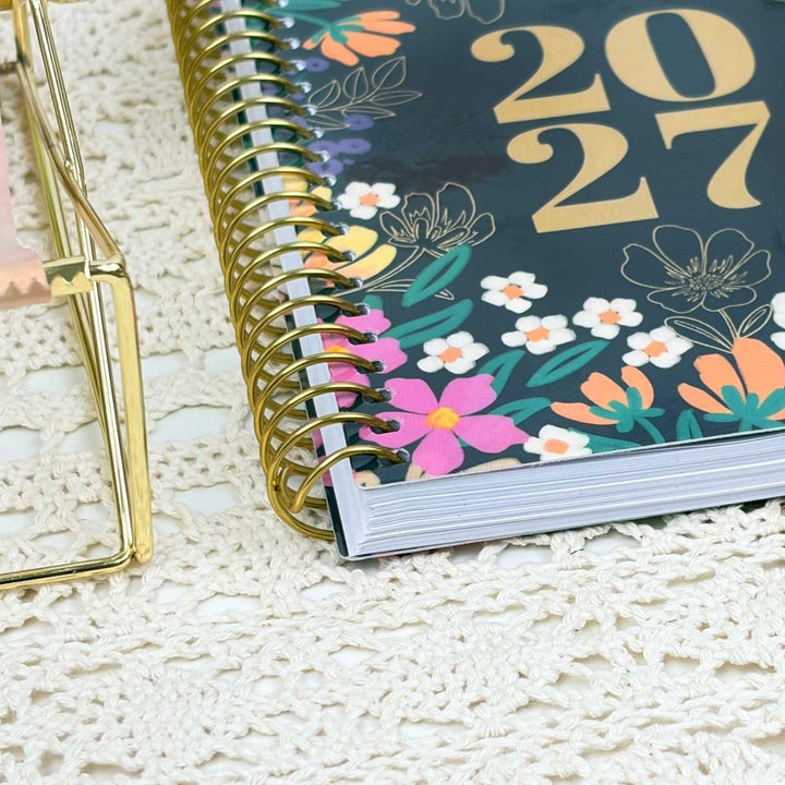 Zoomed in photo of the planners' gold metal binding.