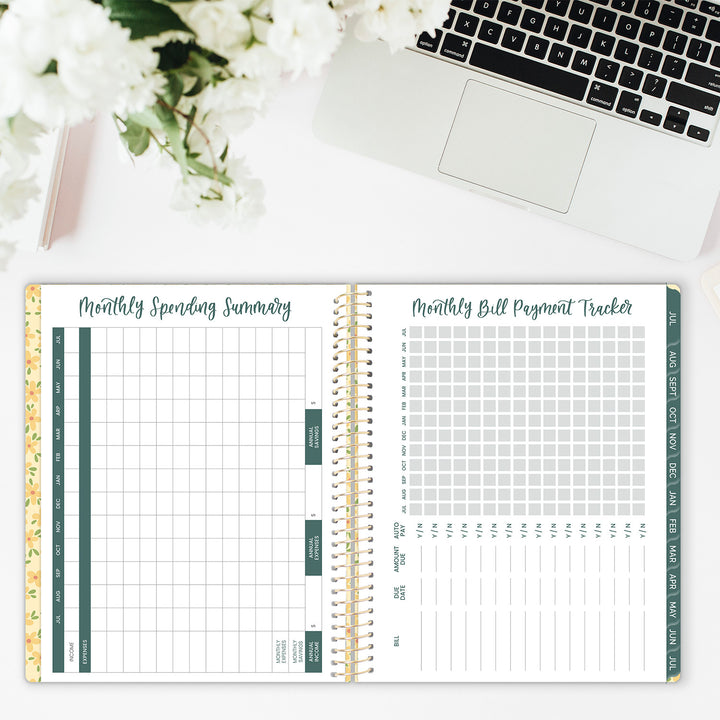 Monthly spending summary and bill tracker spread in an academic planner.