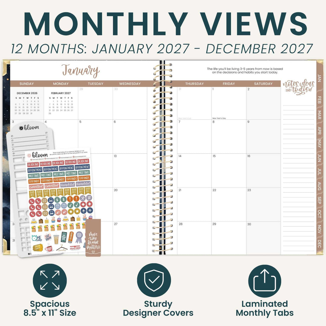 A planner spread showing a monthly calendar layout with decorative header text reading 'MONTHLY VIEWS' and '12 MONTHS: JANUARY 2027 - DECEMBER 2027.' The planner is open in the center, with sticker sheets and a few closed planner covers visible on the left.