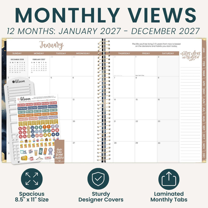 A planner spread showing a monthly calendar layout with decorative header text reading 'MONTHLY VIEWS' and '12 MONTHS: JANUARY 2027 - DECEMBER 2027.' The planner is open in the center, with sticker sheets and a few closed planner covers visible on the left.