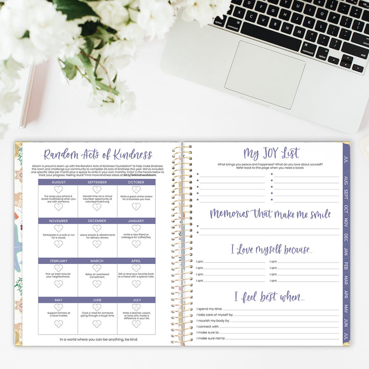 Kindness challenge and joy list spread in an academic year planner on a desk. 