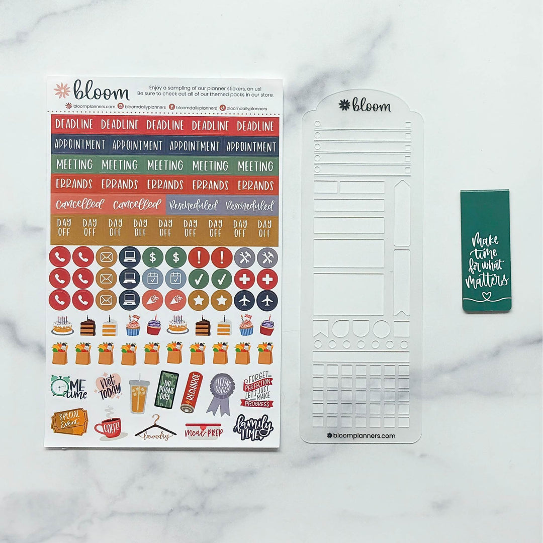 Bloom planner sticker set on a white marble background, featuring a sheet of colorful planner stickers, a white plastic date tracker template, and a green sticky note with white text reading 'Make time for great matters'.