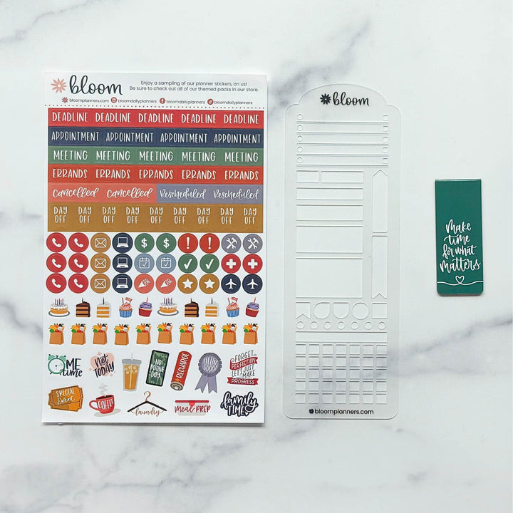 Bloom planner sticker set on a white marble background, featuring a sheet of colorful planner stickers, a white plastic date tracker template, and a green sticky note with white text reading 'Make time for great matters'.