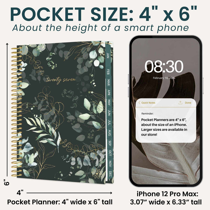 A pocket size planner shown next to an iPhone 12 Pro Max for size comparison. The planner has a dark green floral cover with gold accents and a gold spiral binding.
