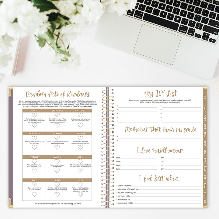 Random acts of kindness challenge and joy list spread in an academic planner on a desk