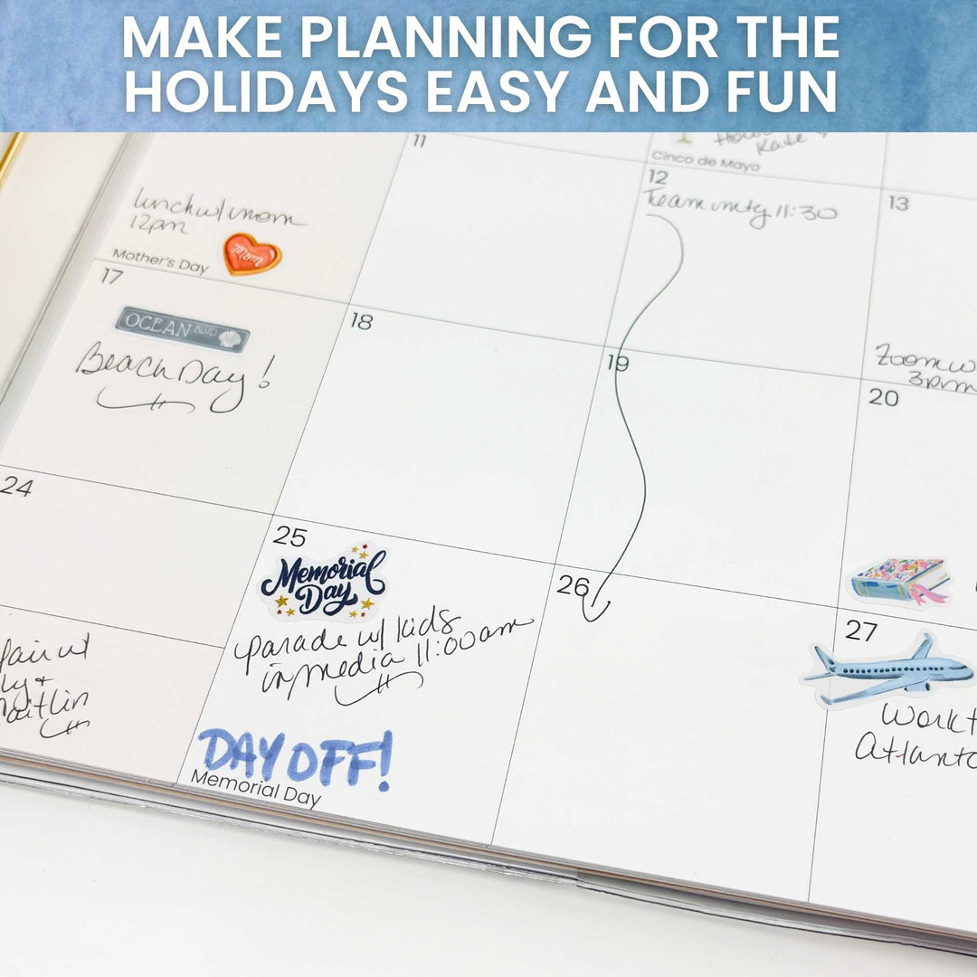 Open planner showing May calendar with Memorial Day and travel stickers in use