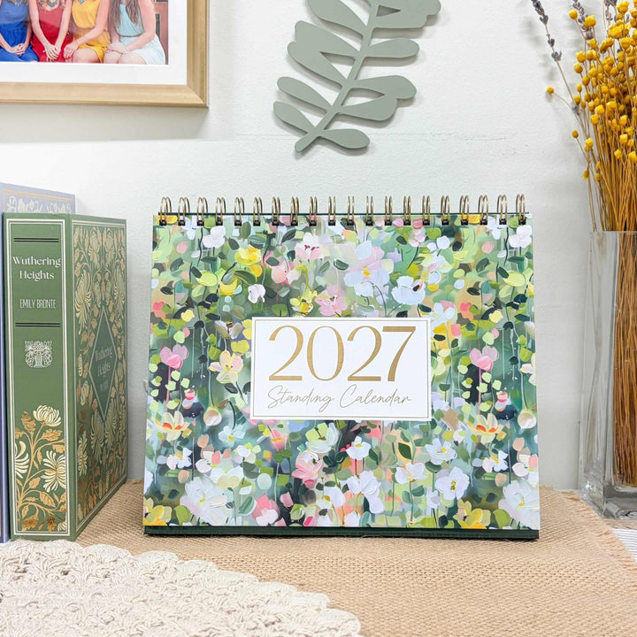 2027 Standing Desk Calendar open to September on a styled desk, 8x10 size.