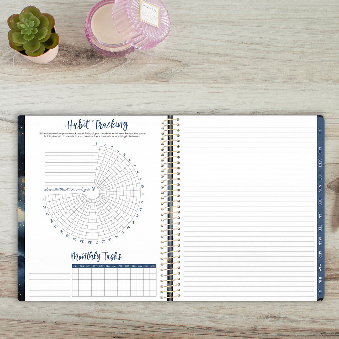 Open planner on a wooden surface with habit tracking and monthly tasks sections.