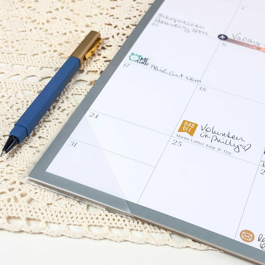 Zoomed in view of a desk calendar with clear protective edges.
