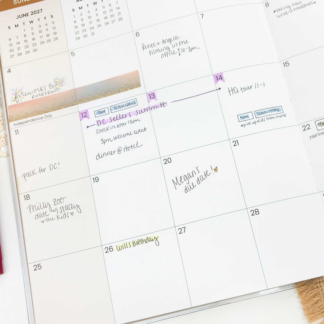 Calendar with handwritten notes and events on a desk