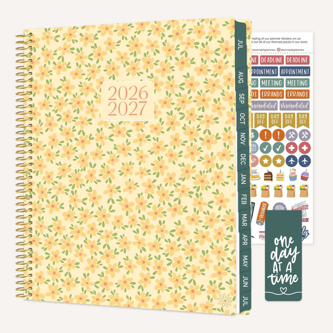 Butter yellow daisy academic year planner with stickers and a bookmark on a white background.