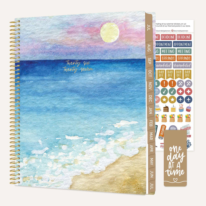 Planner with beach cover and sticker sheet on a white background