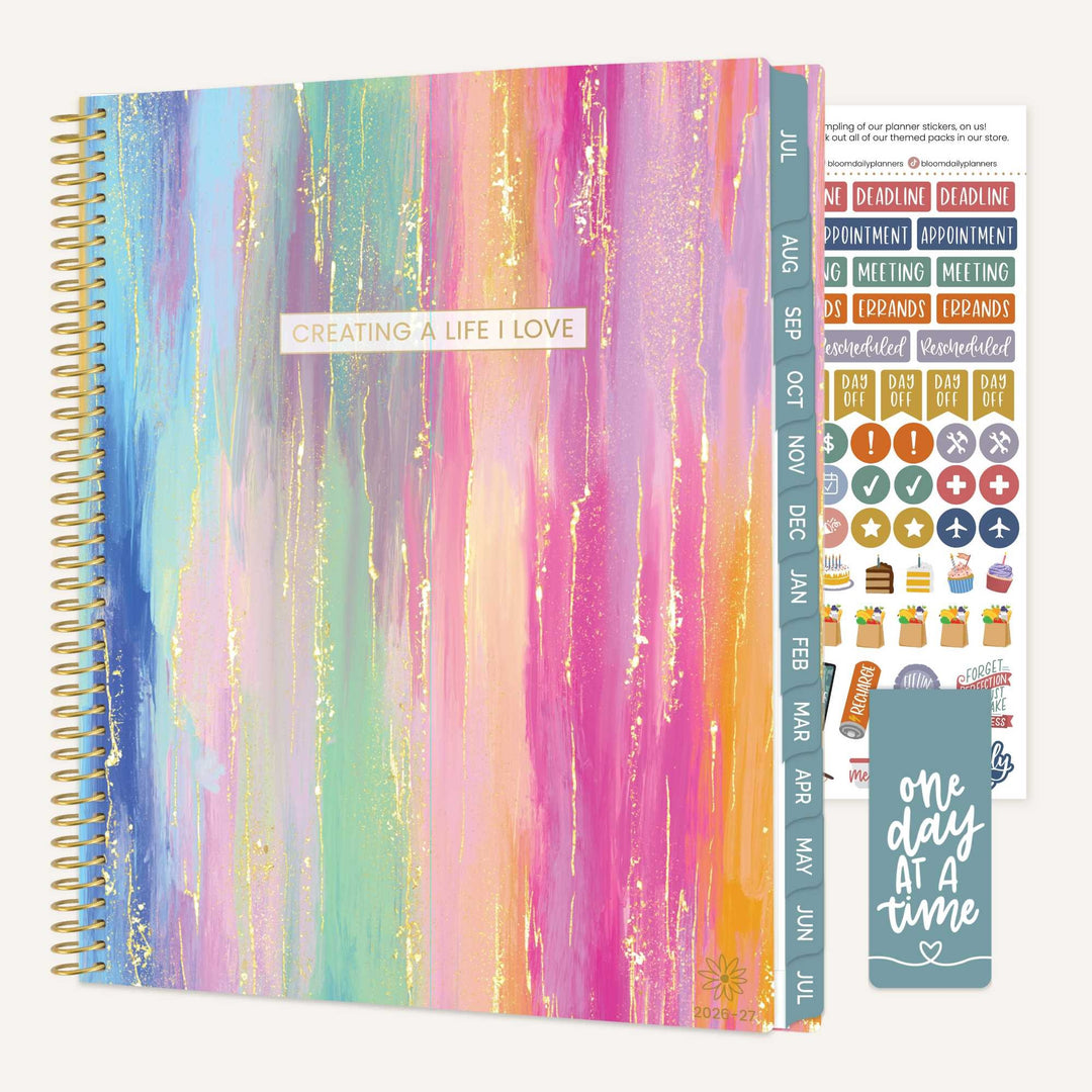 Colorful planner with stickers and a motivational quote on a white background