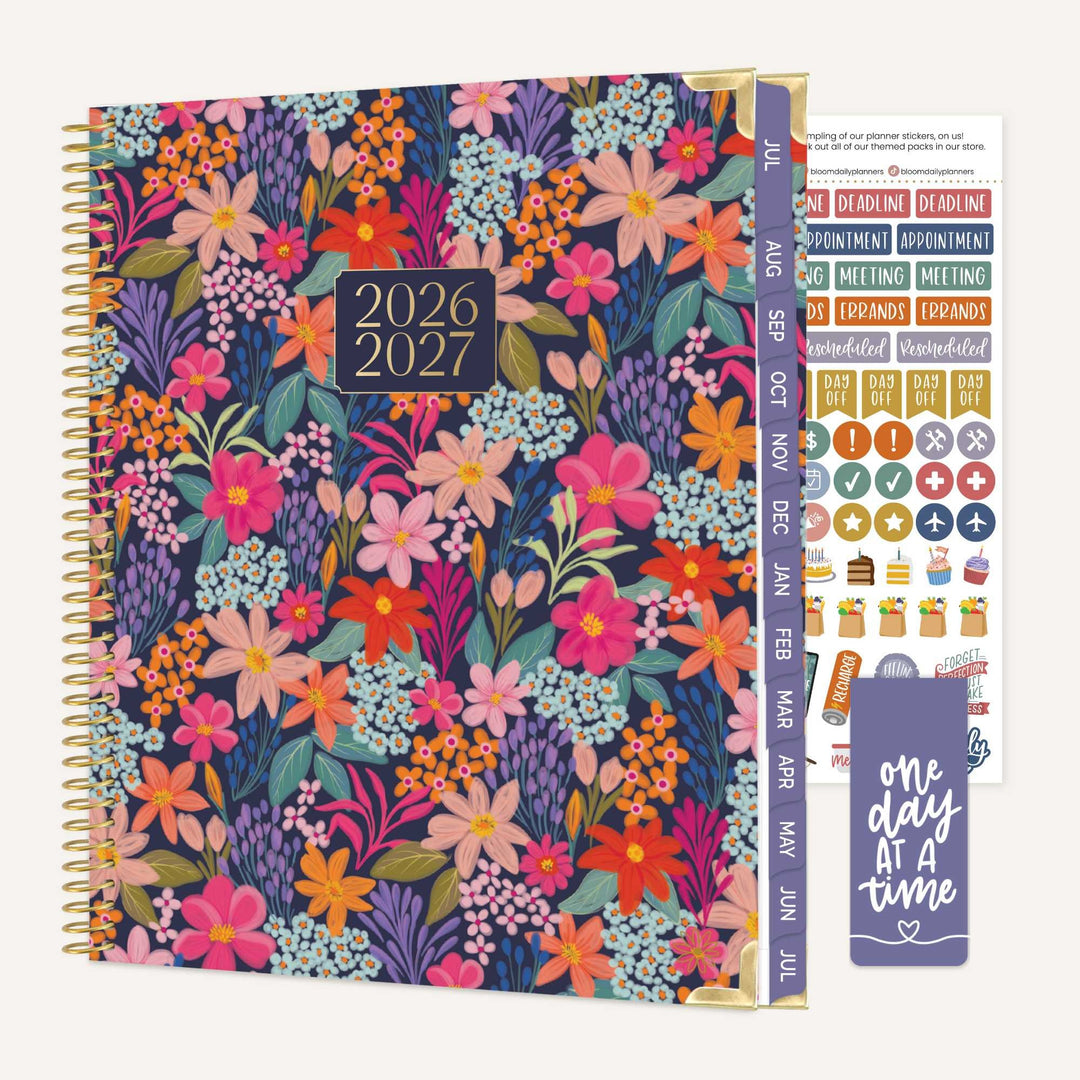 Floral planner with 2026-2027 dates, stickers, and a bookmark on a white background