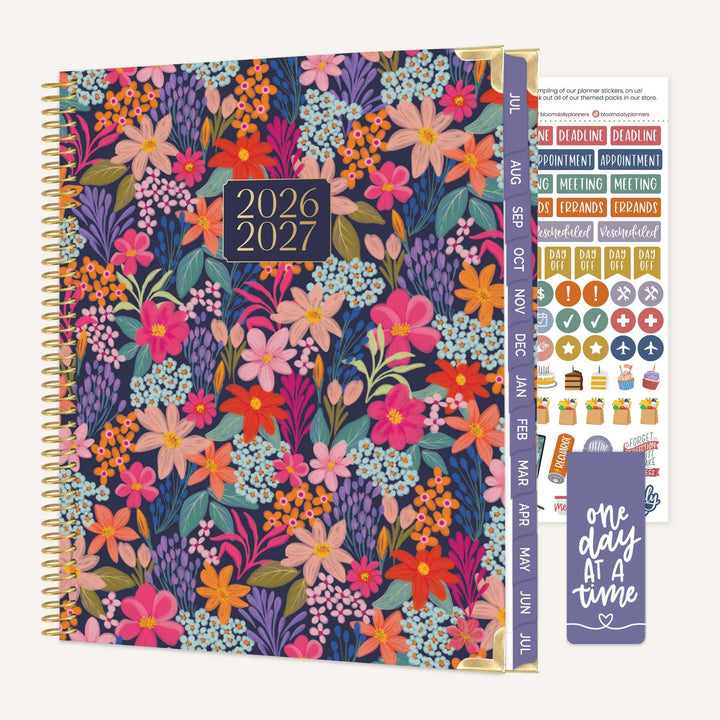 Floral planner with 2026-2027 dates, stickers, and a bookmark on a white background