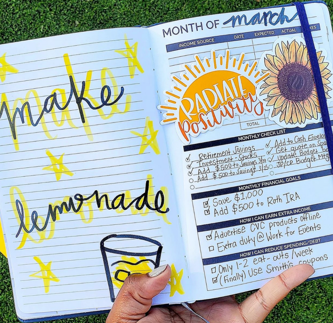 Decorated planner spread with stickers and hand lettering art