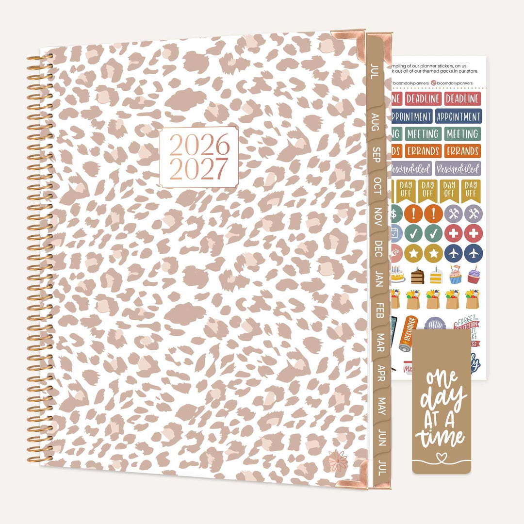 Leopard print planner with stickers on a white background