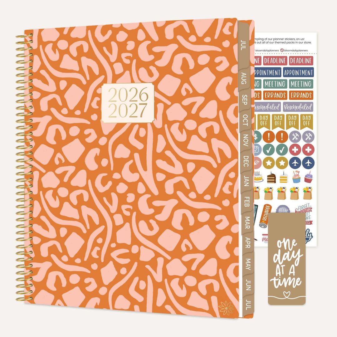Patterned planner with 2026-2027 date range, additional stickers, and motivational quote card.