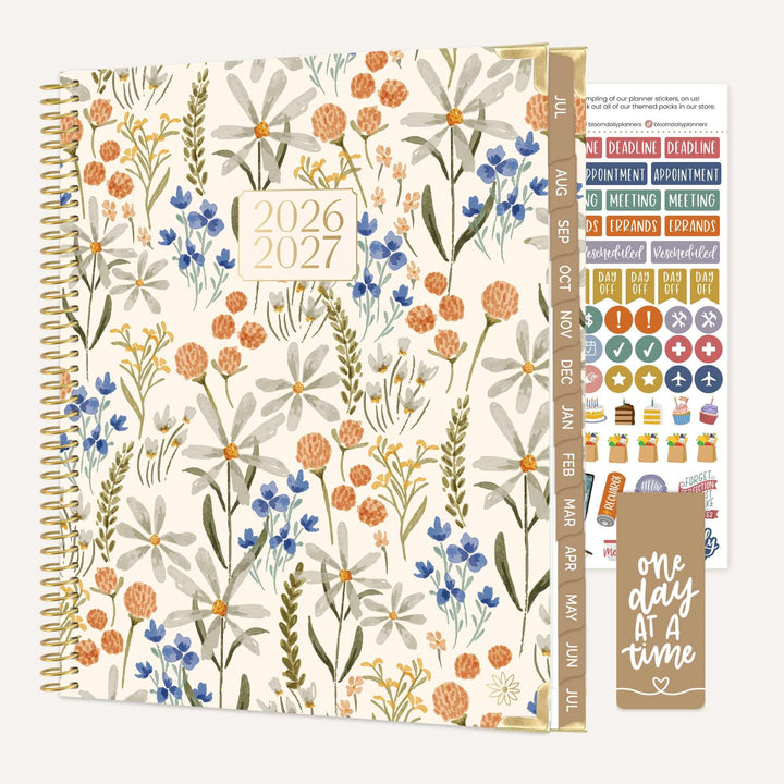 Floral-patterned planner with stickers on a white background